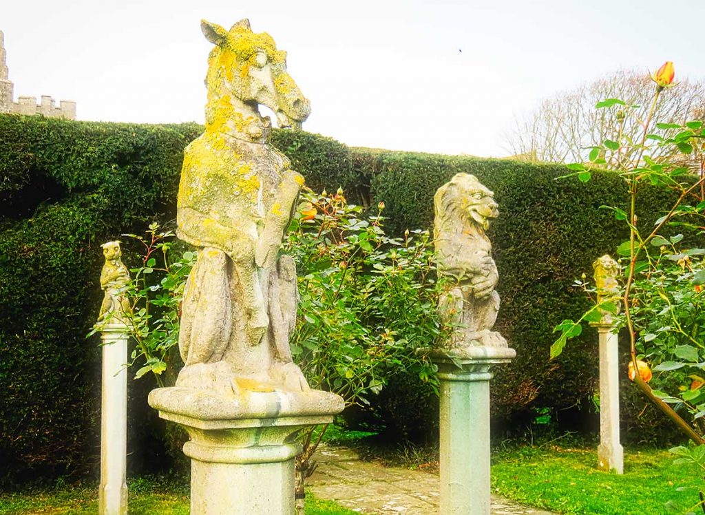 Statues in the rose garden at St Donats Castle
