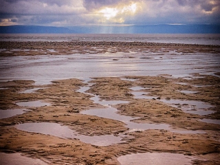 Sun rays over Porlock Weir. Sun rays over Porlock Weir.