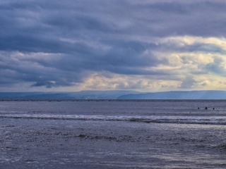 Swimmers, Minehead on the horizon. Swimmers, Minehead on the horizon.