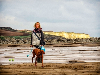 Dog walker and cliffs. Dog walker and cliffs.